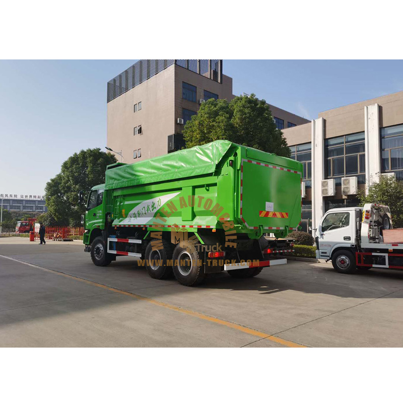 garbage truck dumping at landfill