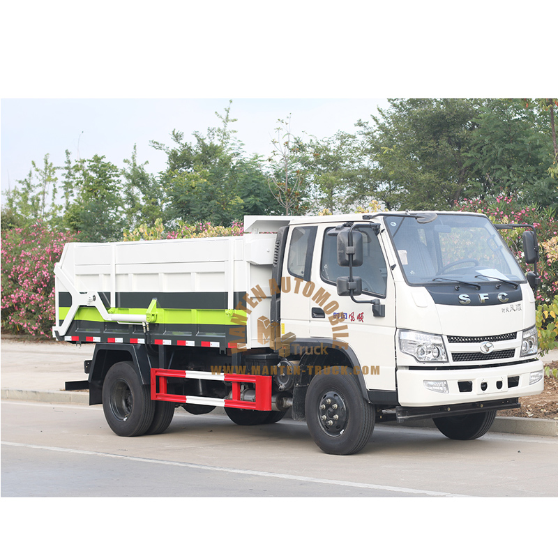 garbage truck lifting dumpster