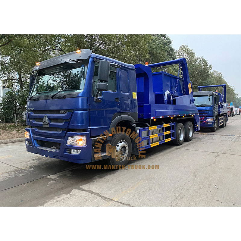 garbage truck lifting dumpster